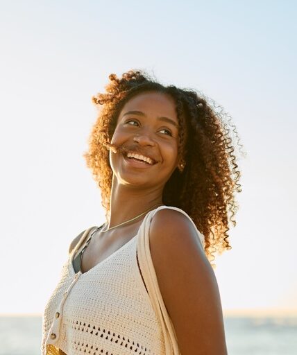 Happy woman with bright healthy smile after cosmetic dentistry in Los Angeles